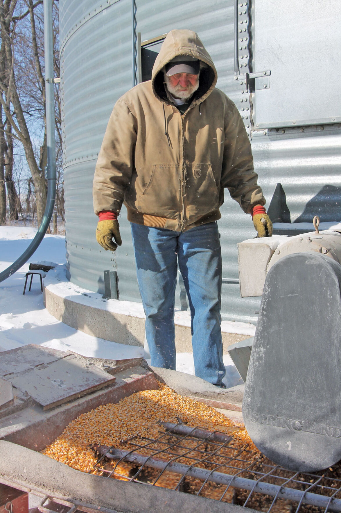 Keith Lovrien loads corn